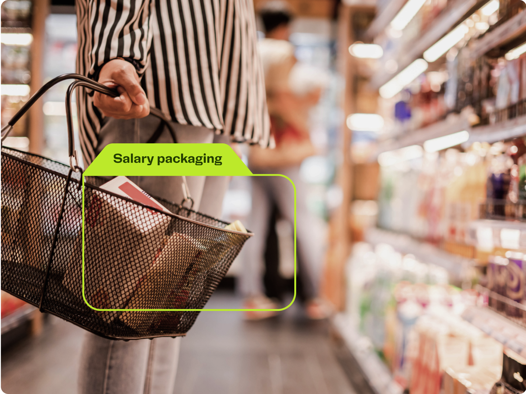 low angle shot of a woman holding a shopping basket in front of supermarketing aisle