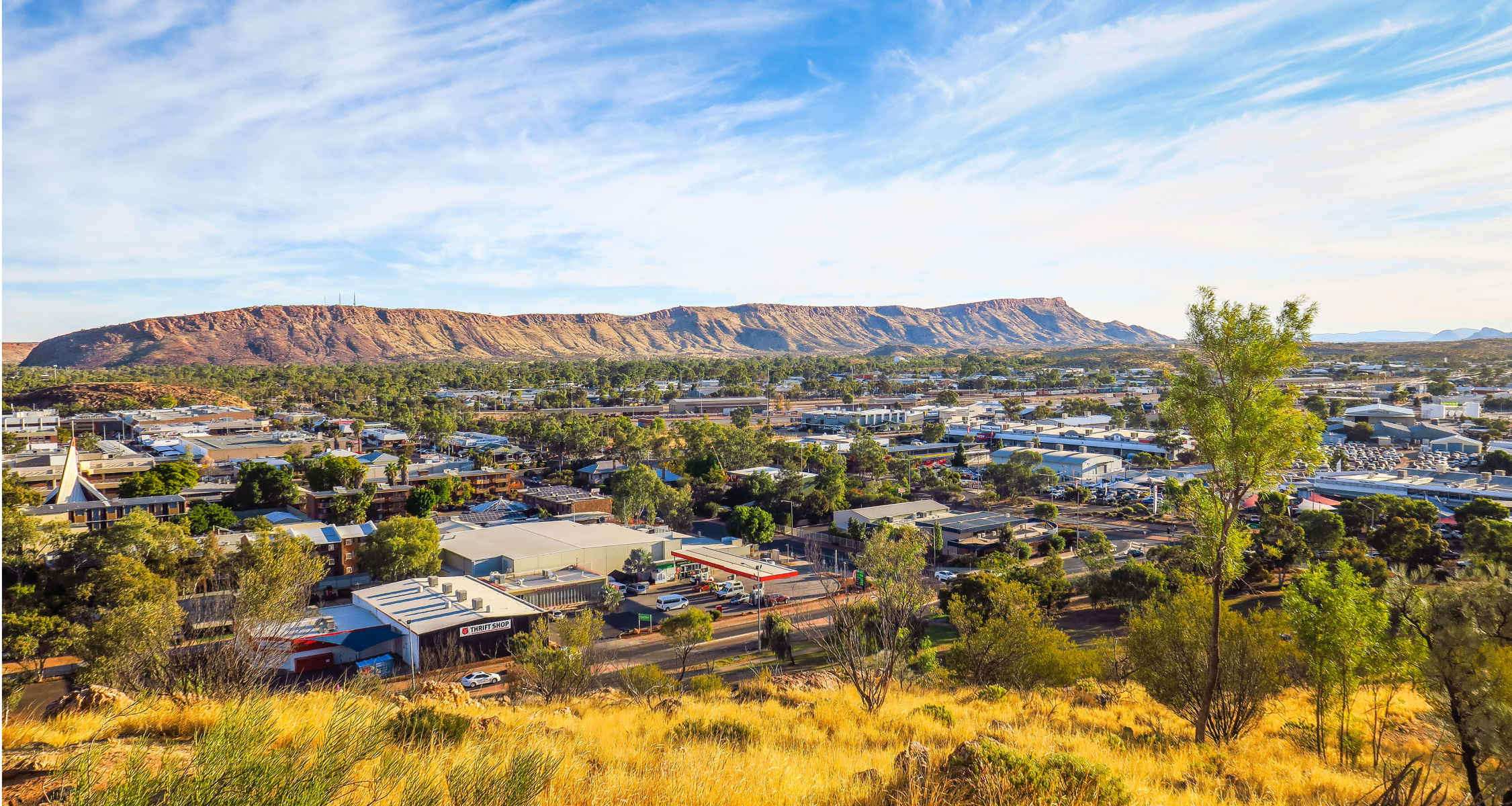 overview of a remote town with mountains in the background