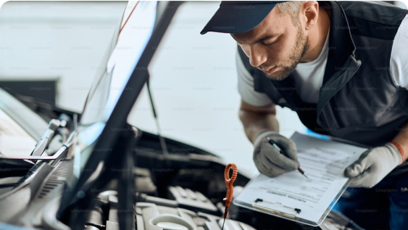 A man inspecting a car