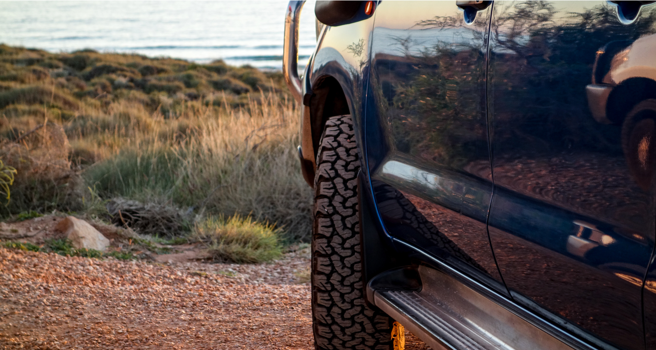 Close up of a car at the beach