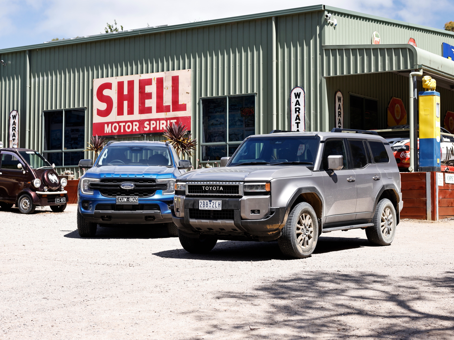 Toyota Landcruiser Prado and Ford Everest at service station