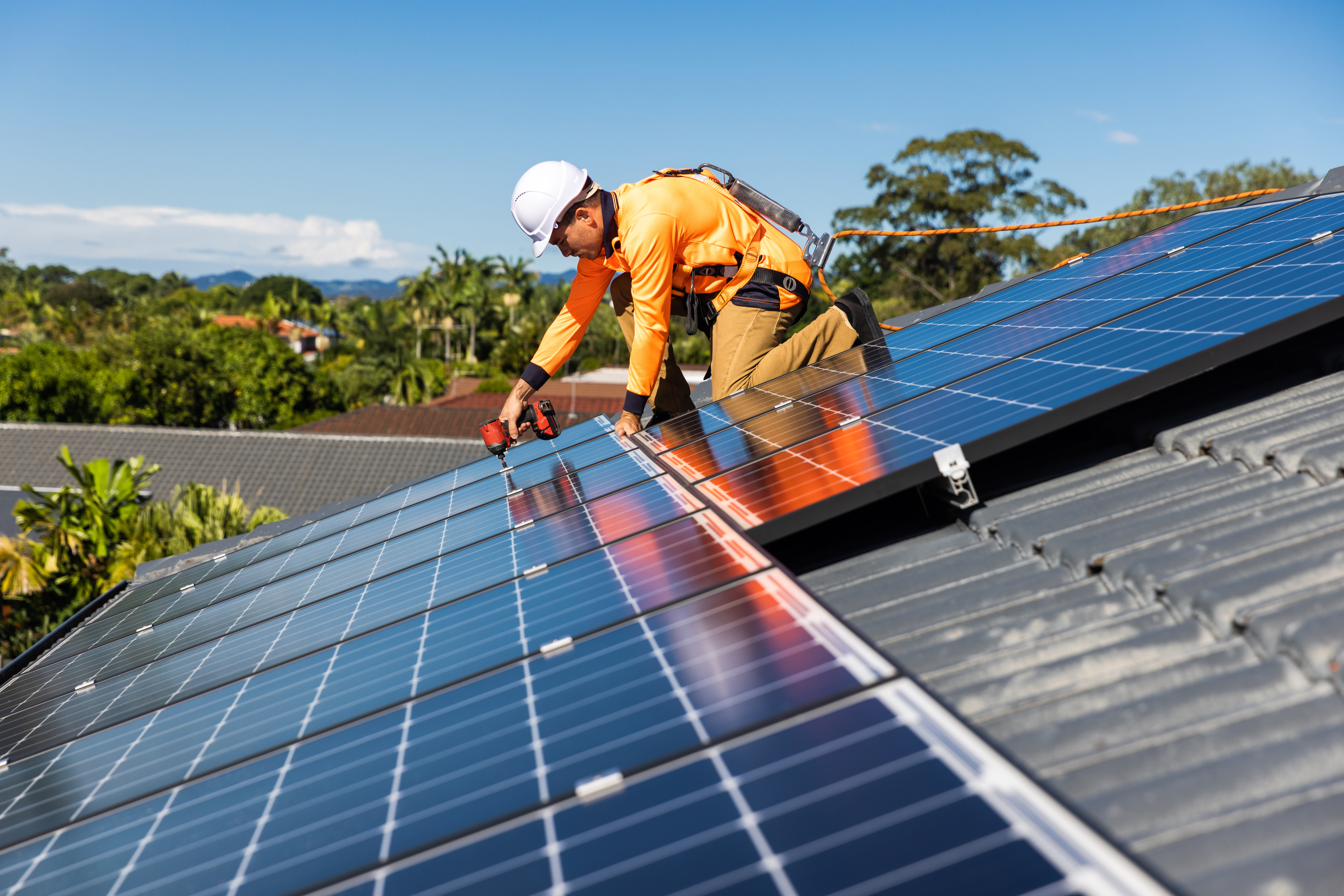 Technician installing solar panels.
