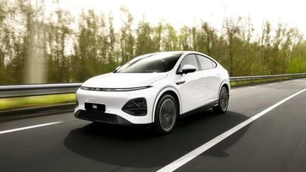 White car driving on the road