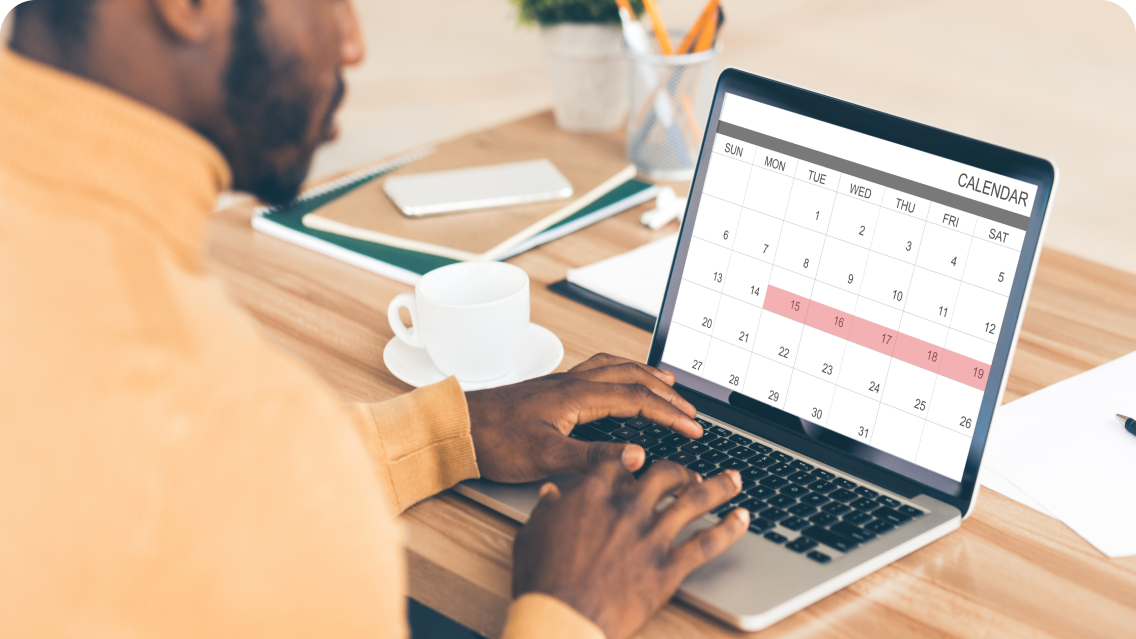 Man filling out a calendar 