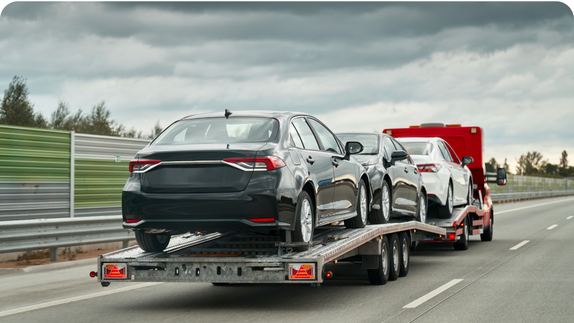 Cars being transported on a trailer
