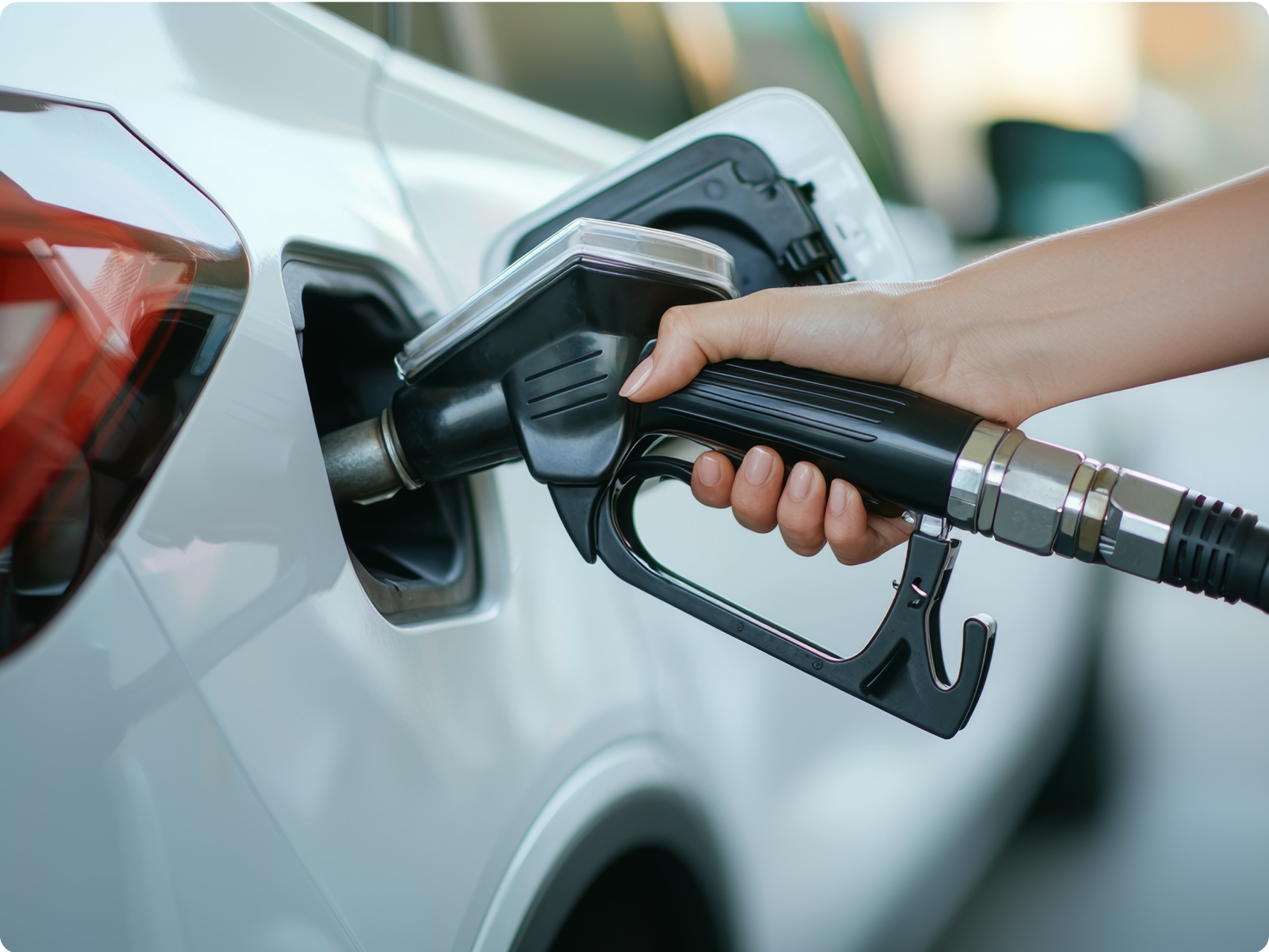 Someone filling their car up with petrol