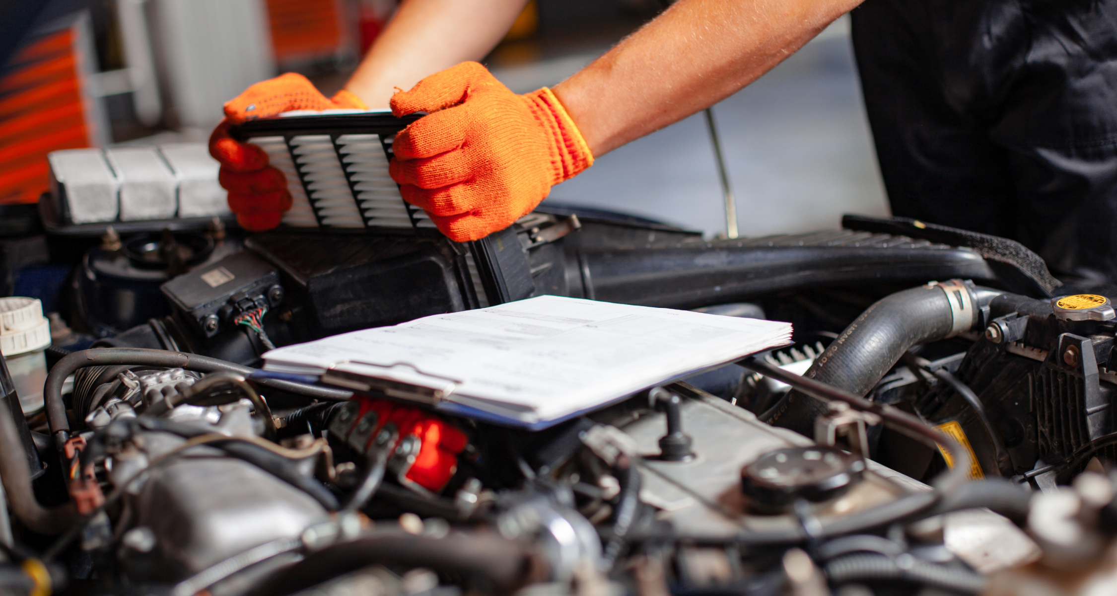 A mechanic replacing a cars radiator 