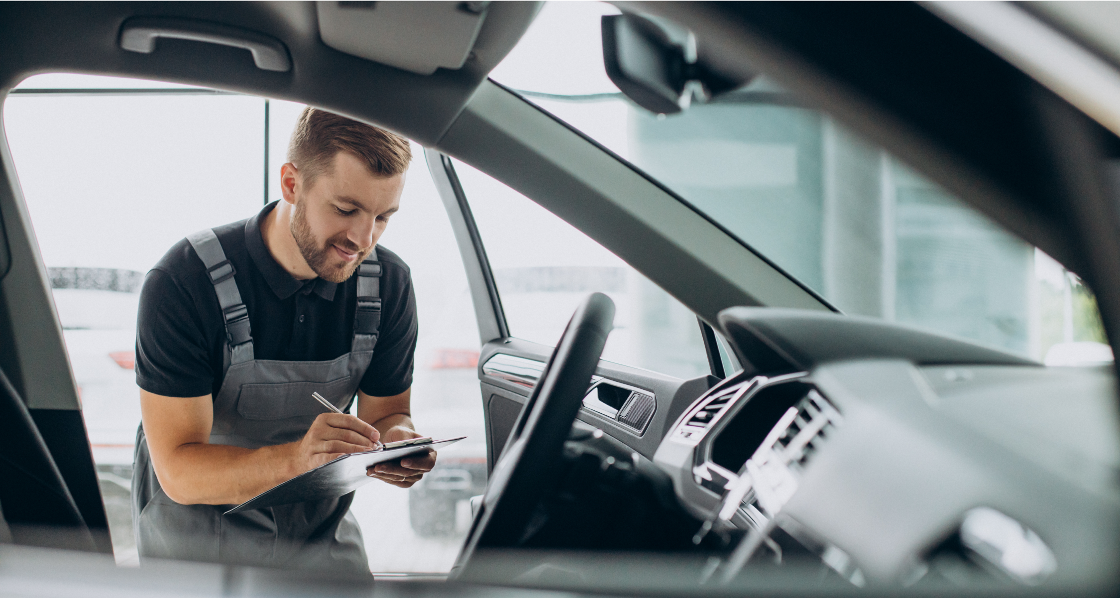 An inspector reviewing a car for rego renewal 