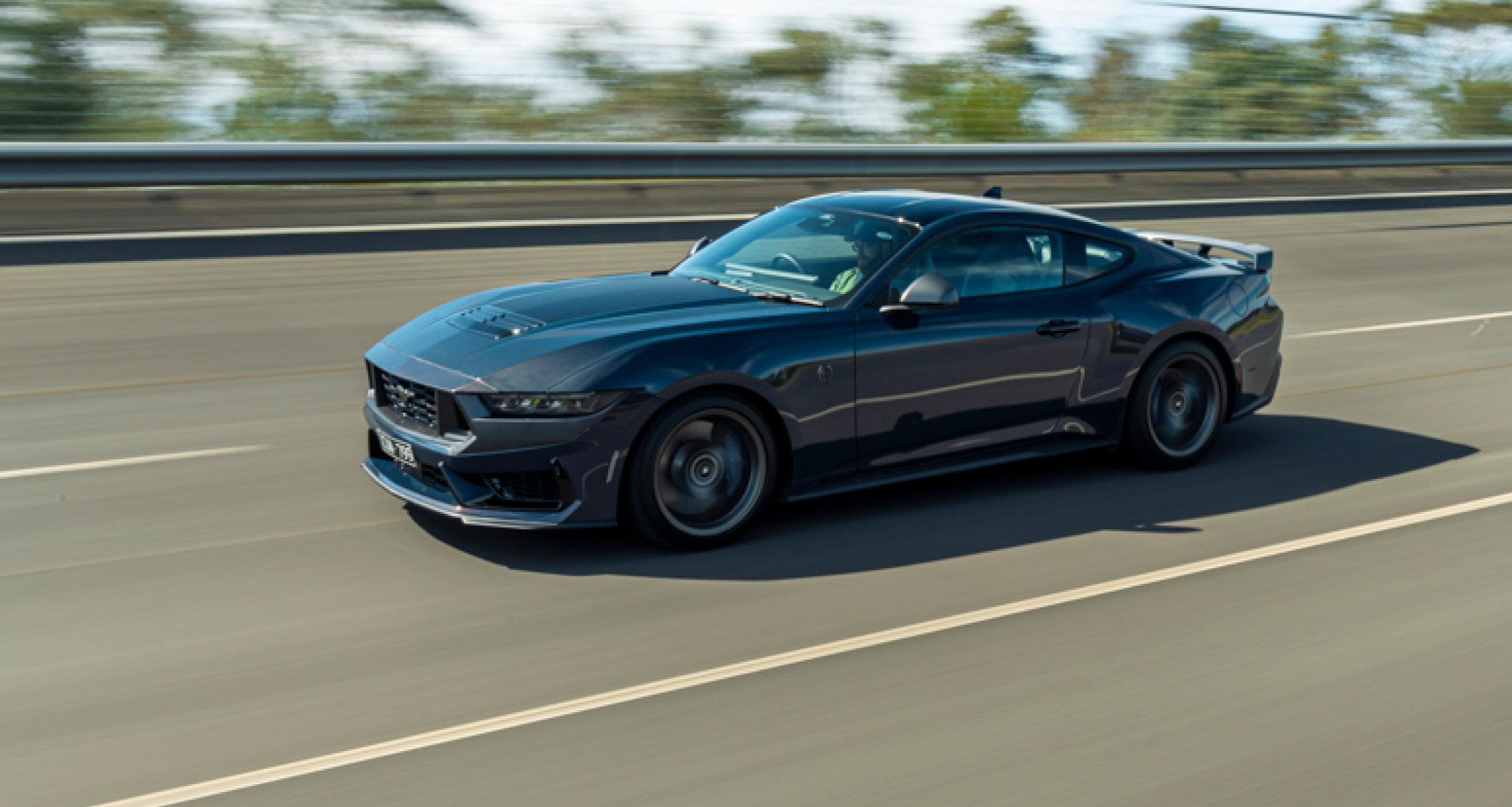 Ford Mustang Dark Horse on racetrack